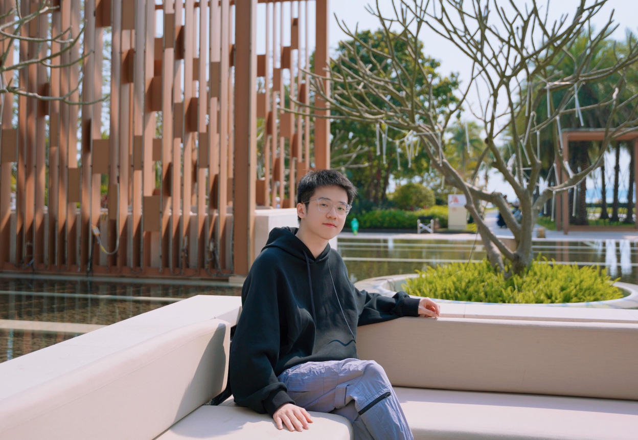 Zongsen Yang seated outdoors on campus